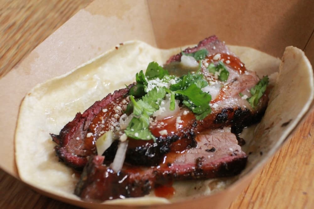 The Rusty Buckle Taco ($5) features a meat topped with cilantro and hot sauce. (Andy Li/Community Impact Newspaper)