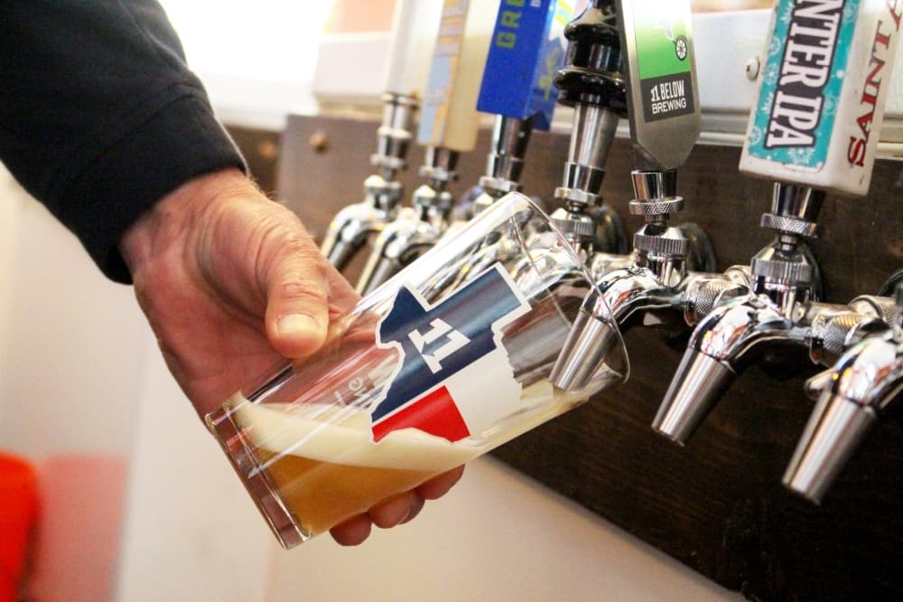 The Hop Stop carries 40-50 different beers rotating through the bar, 16 of which are on tap. (Kelly Schafler/Community Impact Newspaper)