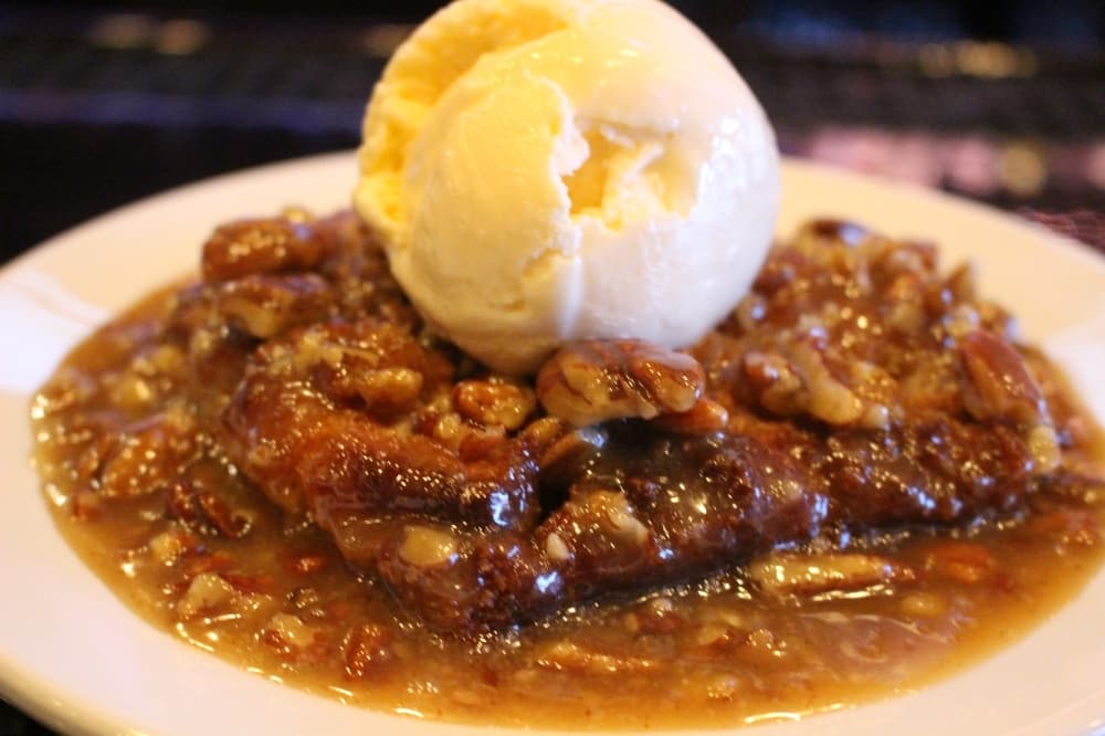 Citizens Grill’s New Orleans bread pudding is baked in-house, covered in pecan praline sauce and served with an optional scoop of Blue Bell ice cream ($9). (Ben Thompson/Community Impact Newspaper)