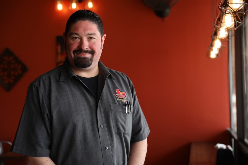 Erich Mota began working with Tommy Tamale at its flagship Grapevine location three years ago. He now manages the Coppell location. (Photos by Liesbeth Powers/Community Impact Newspaper)