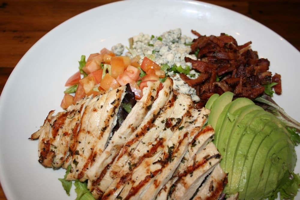 Customers can also order from Benny’s selection of salads, including the Cobb salad ($9.99), which includes grilled chicken, bacon, avocado, tomatoes and bleu cheese crumbles. (Renee Yan/Community Impact Newspaper)