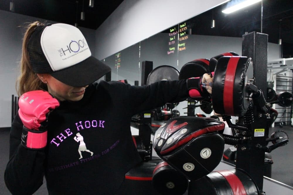 This equipment mimics a coach holding boxing mitts. The pads are numbered for convenience. Clients follow assigned number combos to guide their workouts. (Renee Yan/Community Impact Newspaper)