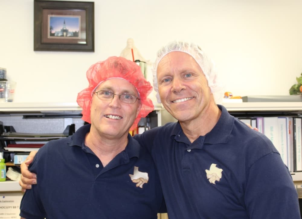 Volunteer Andrew Speckhard (left) frequently works shifts with cannery manager Peter Polis. (Adriana Rezal/Community Impact Newspaper) 
