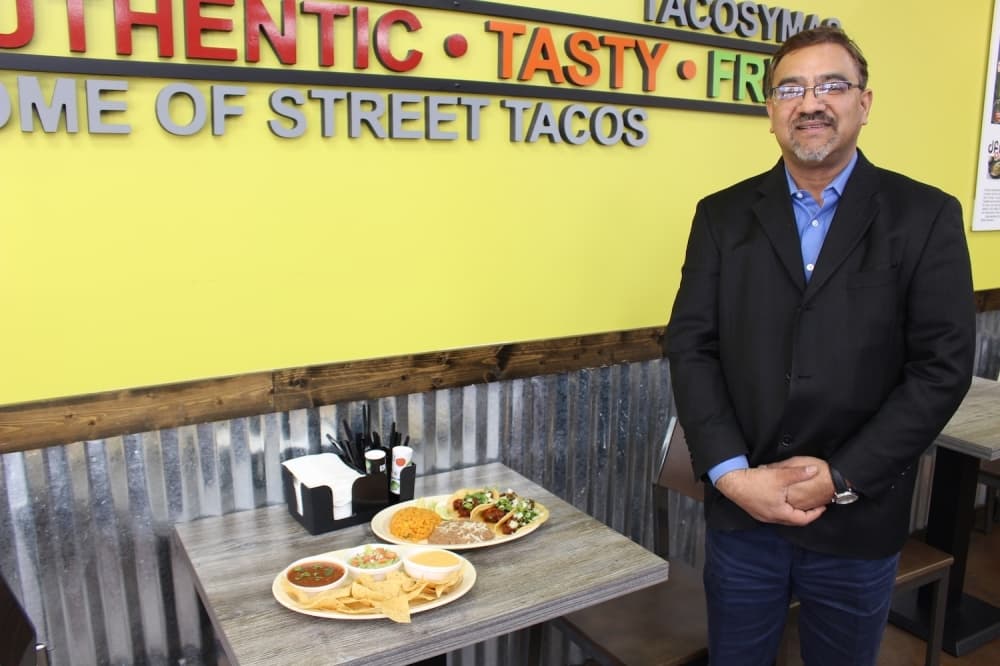Mahbub Zaman opened Tacos Y Mas as a temporary taco stand in 1997. (Olivia Lueckemeyer/Community Impact Newspaper)