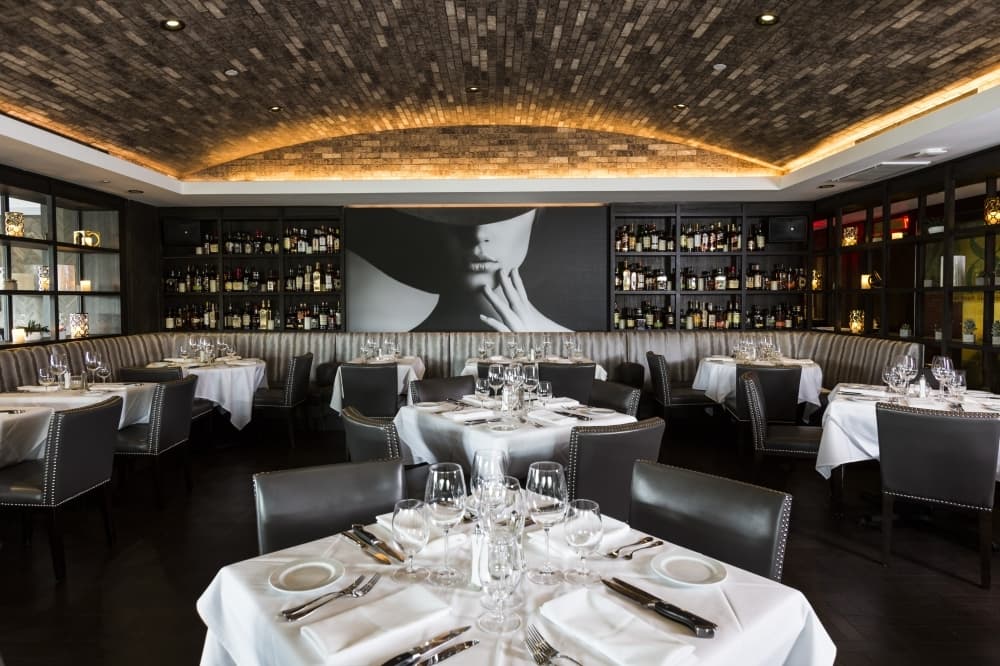 Empty restaurant dining rooms will be the new norm as new restrictions take effect March 17. Local restaurants and shops are adapting by emphasizing pick-up orders and other services. (Courtesy Steak48)