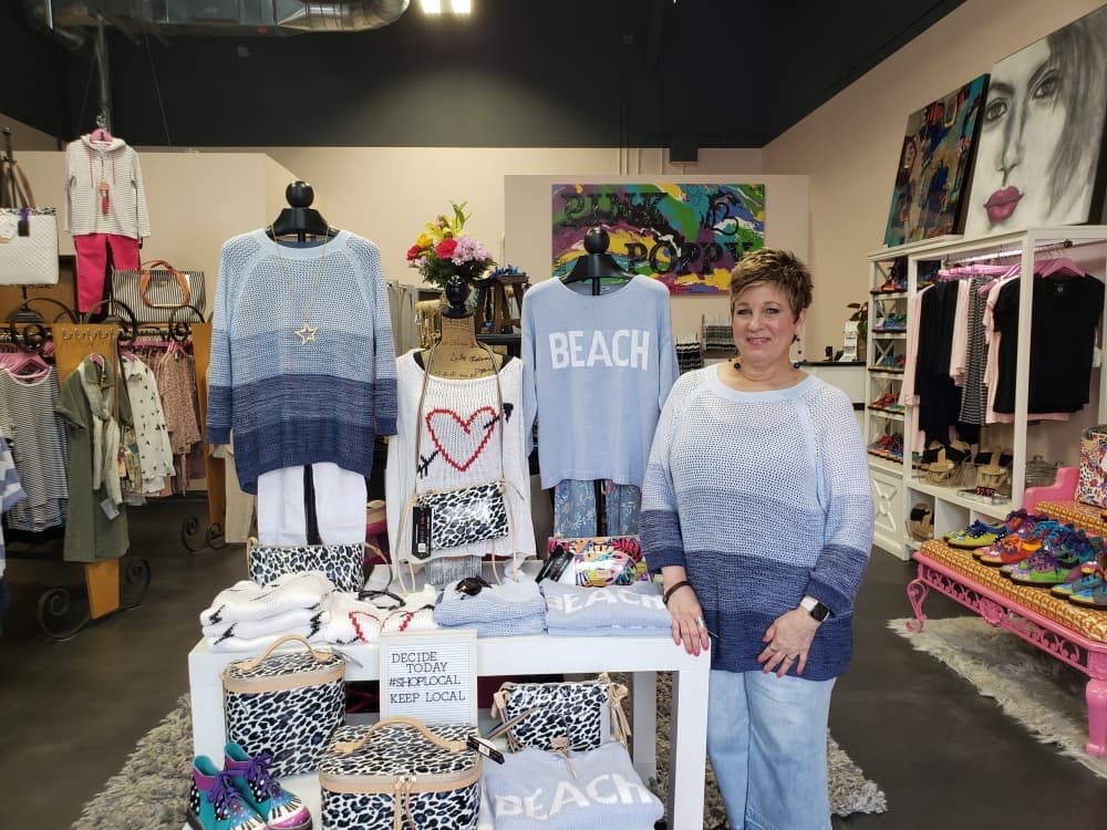 Pink Poppy owner Kay Briggs said her business has taken up broadcasting items on Facebook Live to allow people to shop virtually. (Ali Linan/Community Impact Newspaper)
