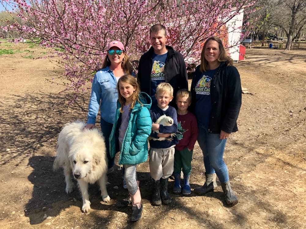 Top left, Director of agritourism Erin Klingemann, Jon and Jonni Meredith, and bottom left, Emma, Henry and Cooper Meredith at Sweet Eats Fruit Farm. 