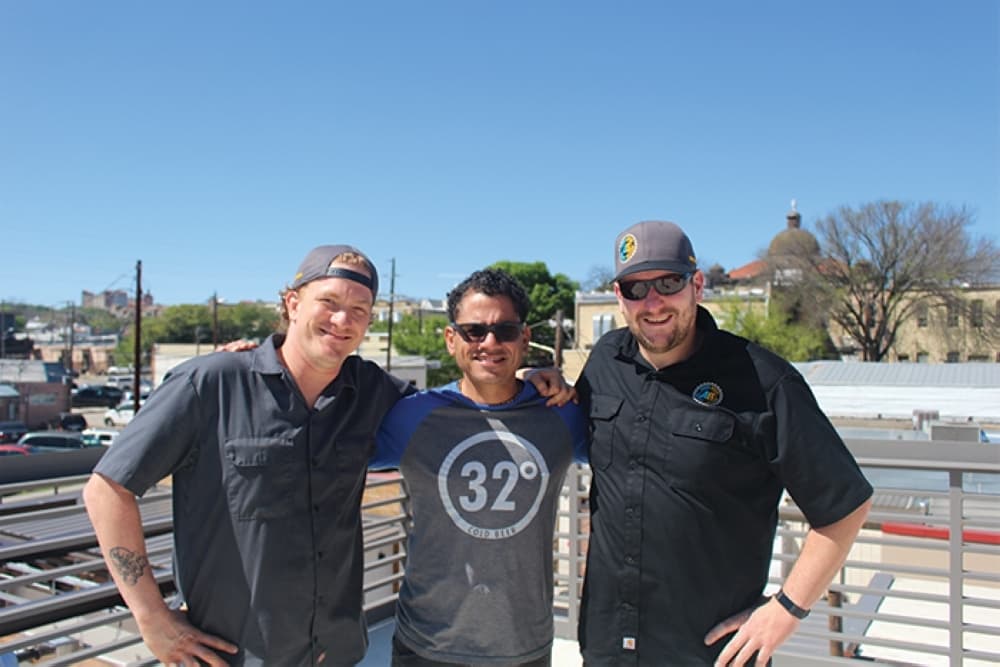 From left: Executive Chef Joe Feldmann, owner Carlos Russo and Head Brewer David Jones oversee operations at AquaBrew. (Community Impact Staff)