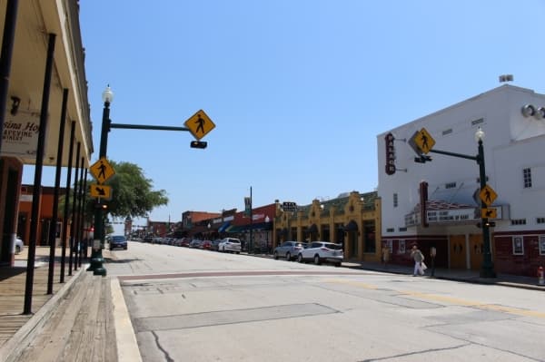 This photo, taken during a fall day on Grapevine's Main Street, shows full parking spaces and plenty of activity before the coronavirus was labeled a pandemic. (Miranda Jaimes/Community Impact Newspaper)