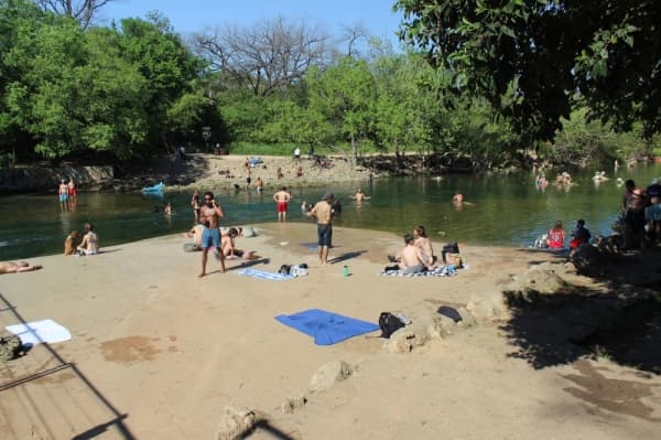  On March 25, the group gathered near Barton Springs Pool was significantly smaller than the crowd on March 24. (Christopher Neely/Community Impact Newspaper) 