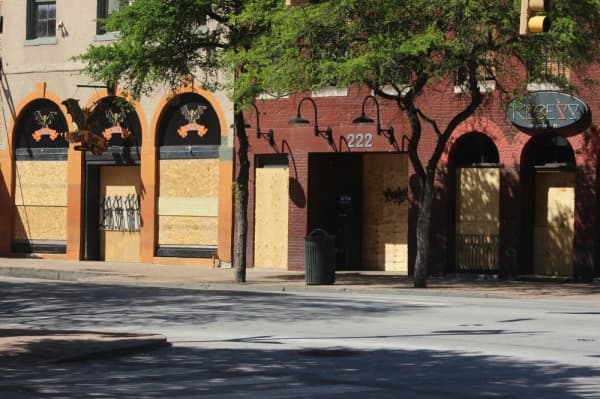 Bars on Sixth Street in Austin boarded up their exteriors when a city order forced them to close. (Christopher Neely/Community Impact Newspaper) 