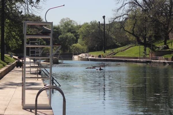 With temperatures reaching into the 90s on March 24, Barton Springs Pool would normally be busy. However, restrictions put in place March 24 closed the pool to the public. (Christopher Neely/Community Impact Newspaper)