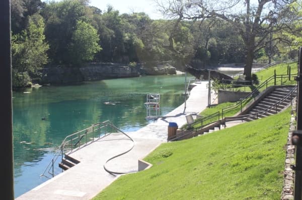 With temperatures reaching into the 90s on March 24, Barton Springs Pool would normally be busy. However, restrictions put in place March 24 closed the pool to the public. (Christopher Neely/Community Impact Newspaper)