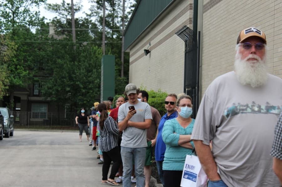 Spring and Klein residents lined up outside Whitmeyer's Distilling Co. on March 31, waiting for free distillery-made hand sanitizer. (Adriana Rezal/Community Impact Newspaper) 