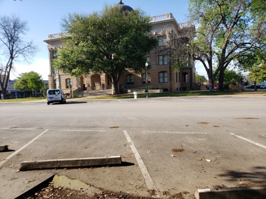 The Williamson County Courthouse grounds were quiet at the center of the Georgetown Square at 5 p.m. on April 1. (Ali Linan/Community Impact Newspaper)