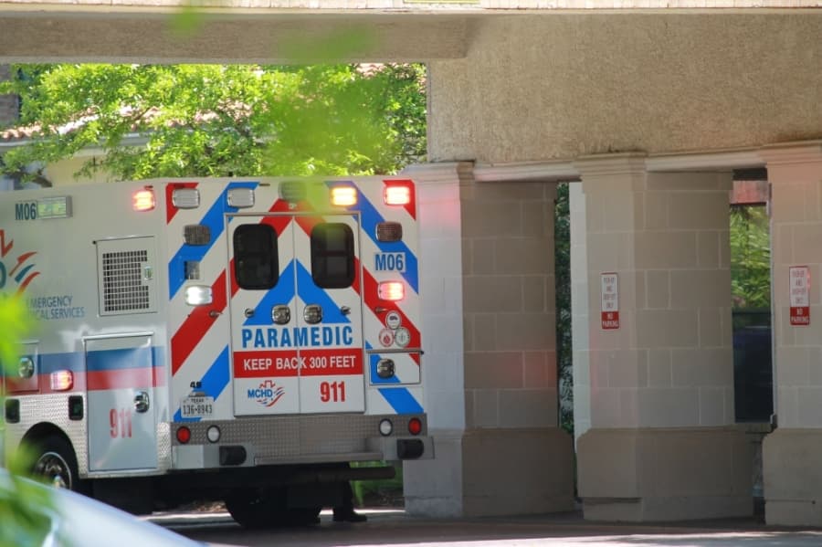 Paramedics arrive at the Conservatory at Alden Bridge on March 31, where all three of the deaths related to COVD-19 have occurred in Montgomery County as of April 3. (Andy Li/Community Impact Newspaper)