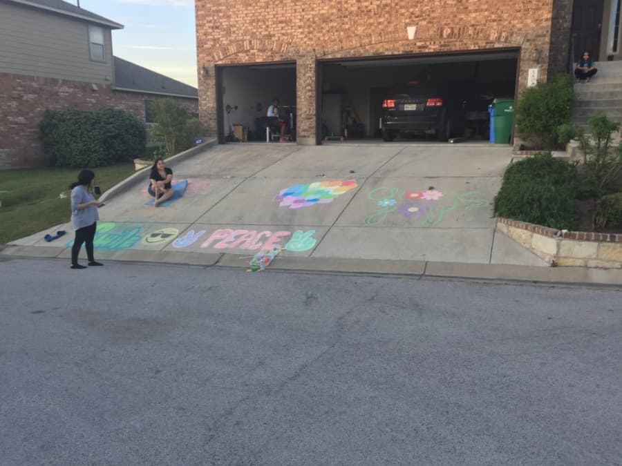 Children decorate their driveway with chalk art. (Courtesy JoAnna Foster)