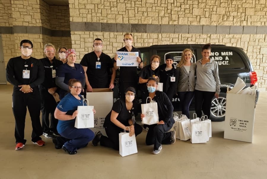 Medical professionals from Baylor Scott & White Medical Center–Centennial in Frisco received a donation of masks and assorted goodies from Two Men and A Truck on April 3. (Courtesy Two Men and A Truck)