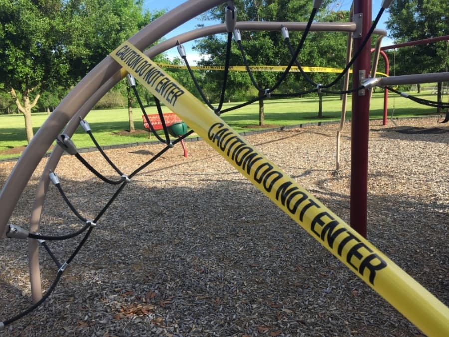 While area trails and green spaces remain open, some playground equipment has been roped off in an effort to prevent the spread of germs. (Taylor Jackson Buchanan/Community Impact Newspaper)