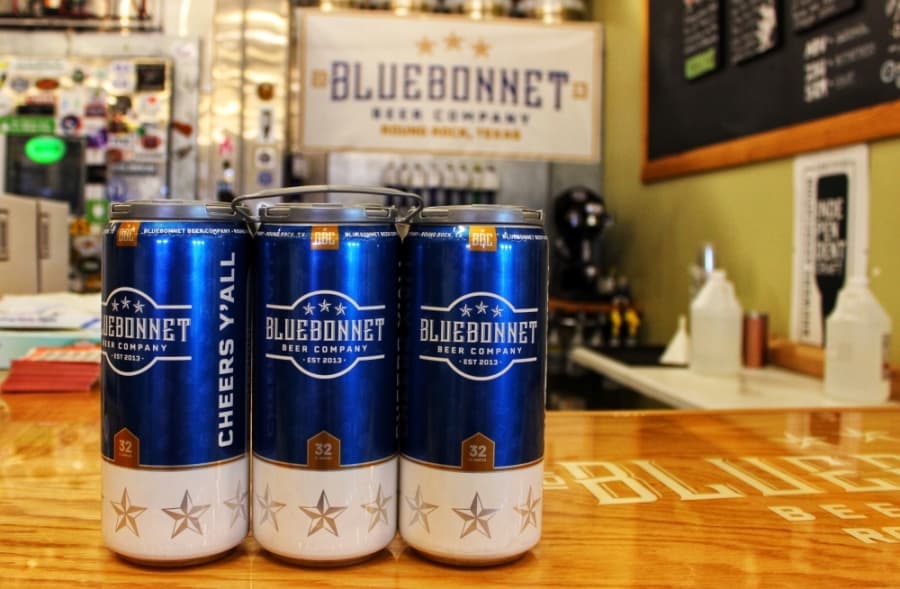 Customers can order crowlers, or 32-ounce cans of beer, freshly packaged from Bluebonnet's taps. (Taylor Jackson Buchanan/Community Impact Newspaper)