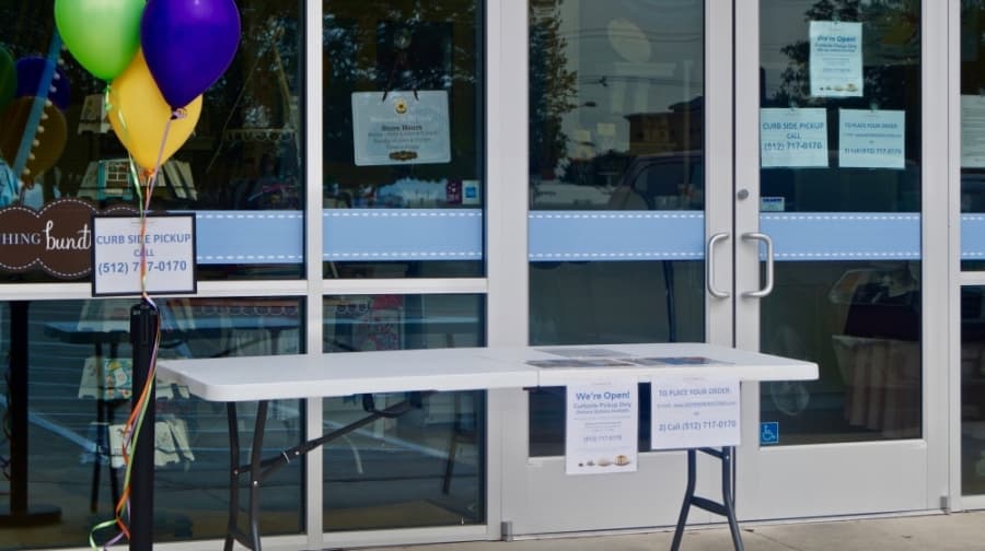 Nothing Bundt Cakes now offers curbside pickup through a makeshift outdoor counter. (Kelsey Thompson/Community Impact Newspaper)