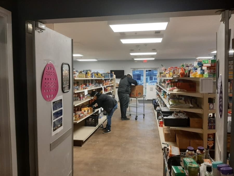 GRACE workers wear masks while collecting items in the food pantry for the drive-thru line. (Courtesy GRACE)