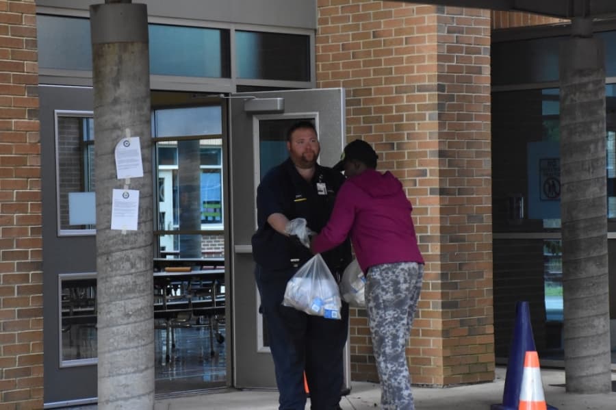 Members of Richardson ISD staff are handing off meals to parents on a daily basis. (Makenzie Plusnick/Community Impact Newspaper)