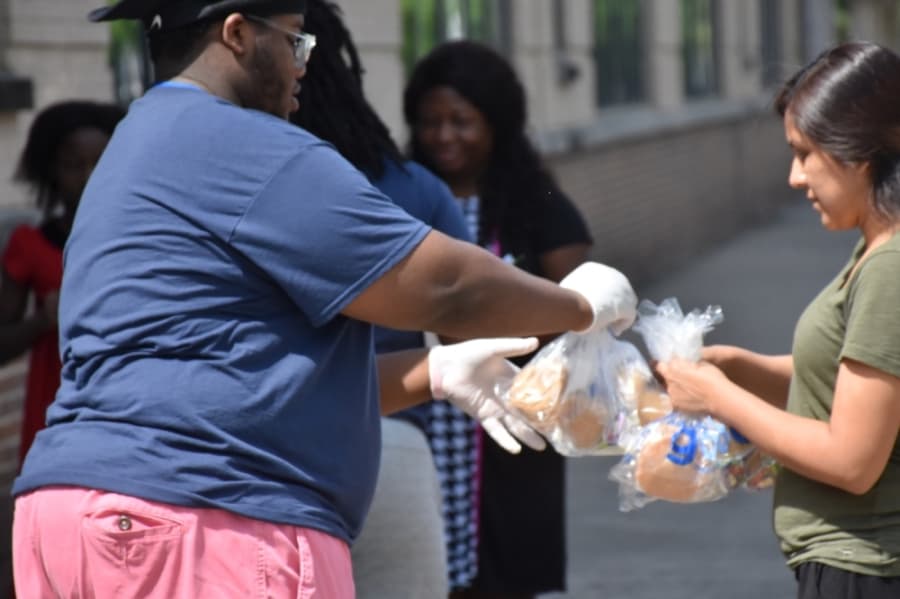 Nonprofit Be A Champion is also handing out grab-and-go meals at RISD's pickup locations. (Makenzie Plusnick/Community Impact Newspaper)