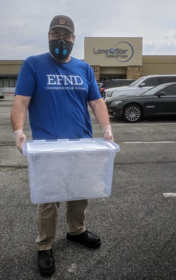 Georgetown High School teacher Robert Thomas, left, made 500 face shields to help area health care workers. (Courtesy Georgetown Health Foundation)