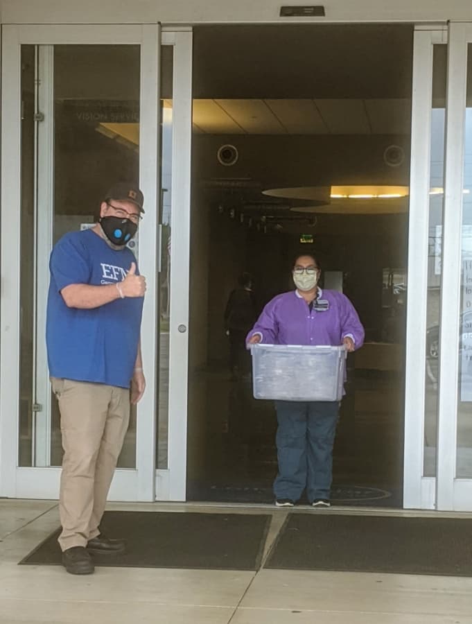 Georgetown High School teacher Robert Thomas, left, made 500 face shields to help area health care workers. (Courtesy Georgetown Health Foundation)