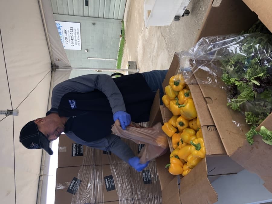 Frisco Fighters head coach Clint Dolezel helps package meals for Grace Bridge Food Bank. (Courtesy Frisco Fighters)