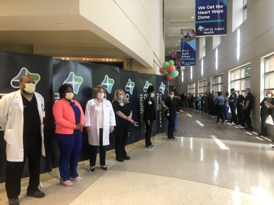 Hospital staff lined a hallway to celebrate Hernandez's discharge before he exited the facility April 15. (Courtesy CHI St. Luke's Health—The Woodlands Hospital)