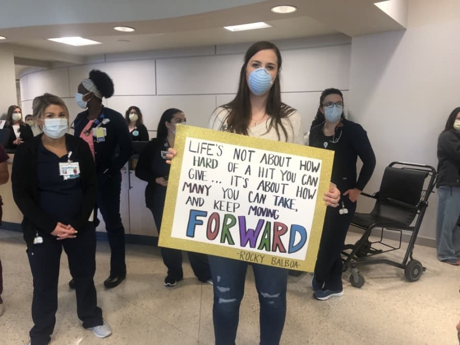 A hospital staff member held up a sign of support for Hernandez prior to his discharge. (Courtesy CHI St. Luke's Health—The Woodlands Hospital)
