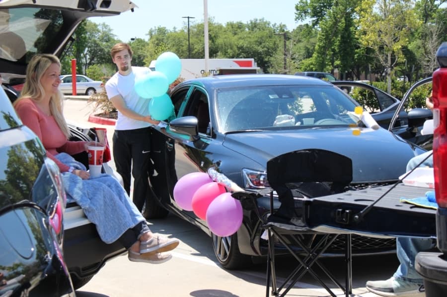 From her car in a parking lot on April 15, Kingwood resident Sherrie Jennings celebrated her birthday surrounded by her family. (Kelly Schafler/Community Impact Newspaper)