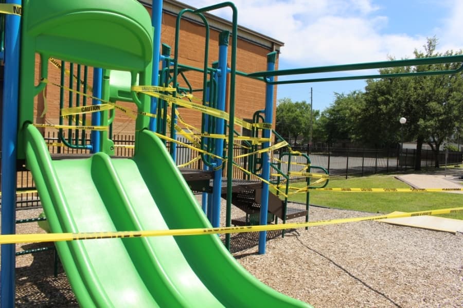 Uptown Park in Humble has been taped off from the community amid the coronavirus. On April 15, the playgrounds, tables, benches and stage were taped. (Kelly Schafler/Community Impact Newspaper)