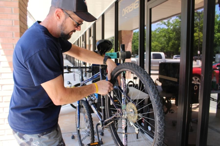 Longtime customer Mark Wood volunteered his time on April 15 to help Tailwind Bicycles work through its plethora of orders that have come in since stay-at-home orders were issued. (Kelly Schafler/Community Impact Newspaper)