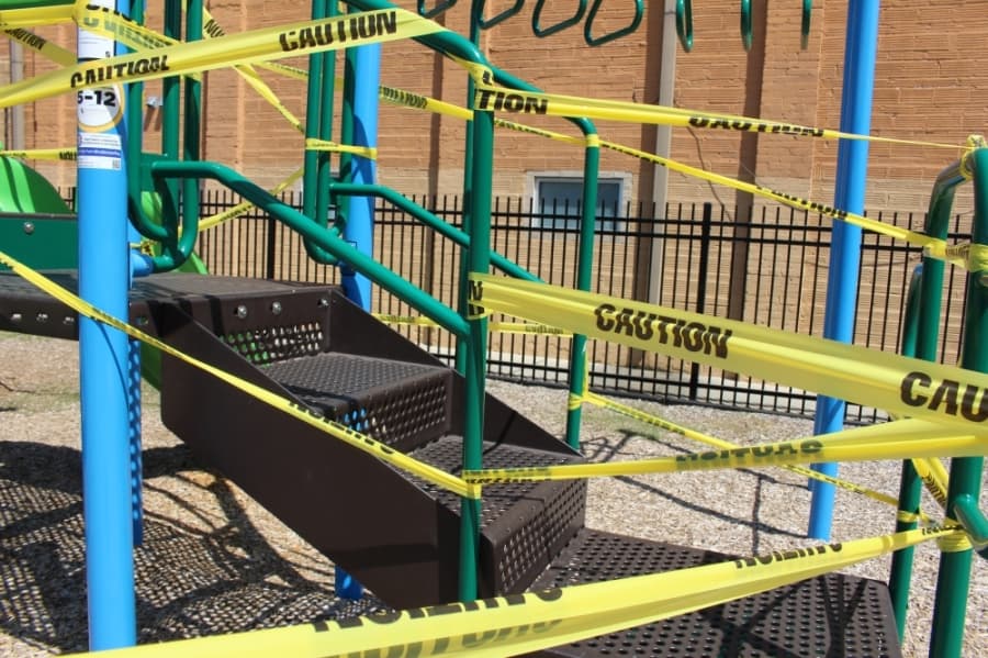 Uptown Park in Humble has been taped off from the community amid the coronavirus. On April 15, the playgrounds, tables, benches and stage were taped. (Kelly Schafler/Community Impact Newspaper)