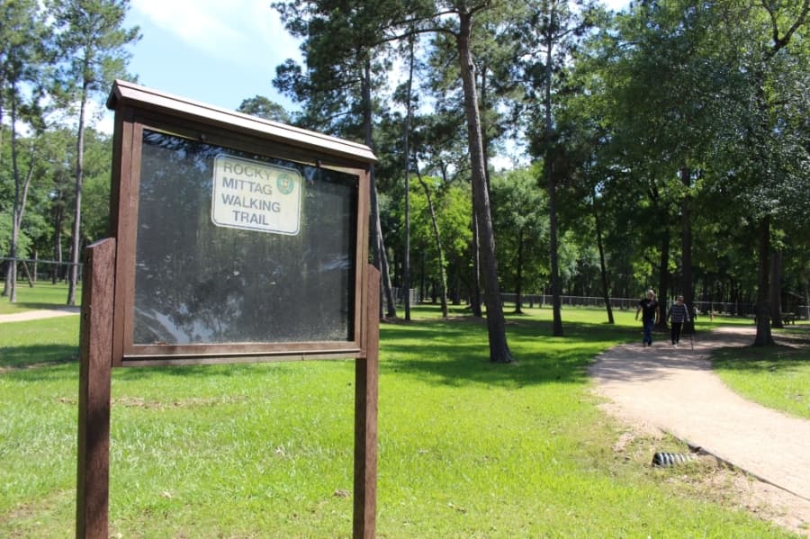 On any given day, individuals can be seen walking and jogging the roughly 2-mile dirt track around Schott Park in Humble. (Kelly Schafler/Community Impact Newspaper)