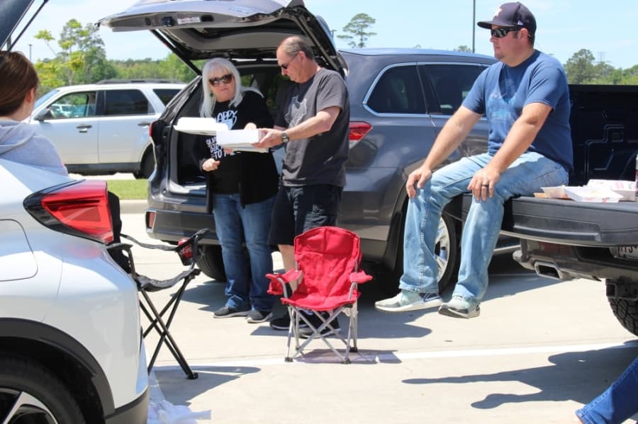 From her car in a parking lot on April 15, Kingwood resident Sherrie Jennings celebrated her birthday surrounded by her family. (Kelly Schafler/Community Impact Newspaper)