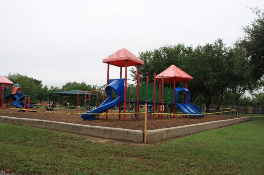 The Malcolm E. Beckendorrf Family Park has caution tape around its playground to ensure children do not go on the slides and swings. (Jen Para/Community Impact Newspaper)