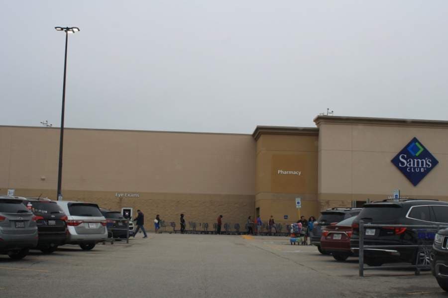 Customers wait outside the Sam's Club at 20424 Katy Freeway, Katy, as the location enforces social distancing inside the store April 4. (Jen Para/Community Impact Newspaper)