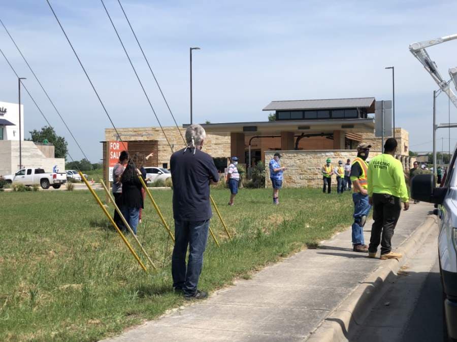 Some San Marcos residents arrived hours before the procession was in route to Wonder World Drive to pay their respects to the fallen San Marco Police officer. (Evelin Garcia/ Community Impact Newspaper)