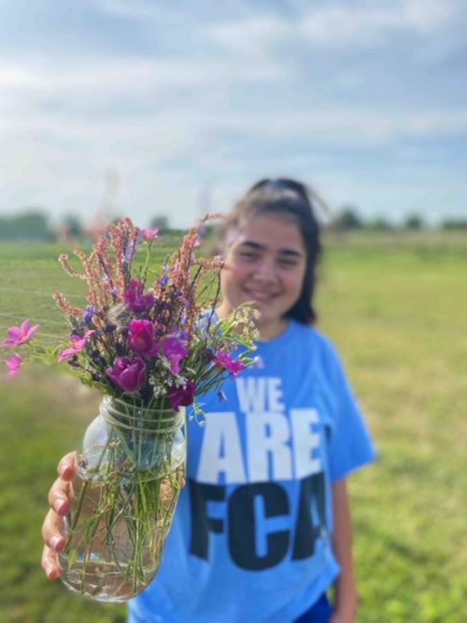 Katy High School student Kennedy Romo shows off her bouquet. (Courtesy Ashlee Laird)