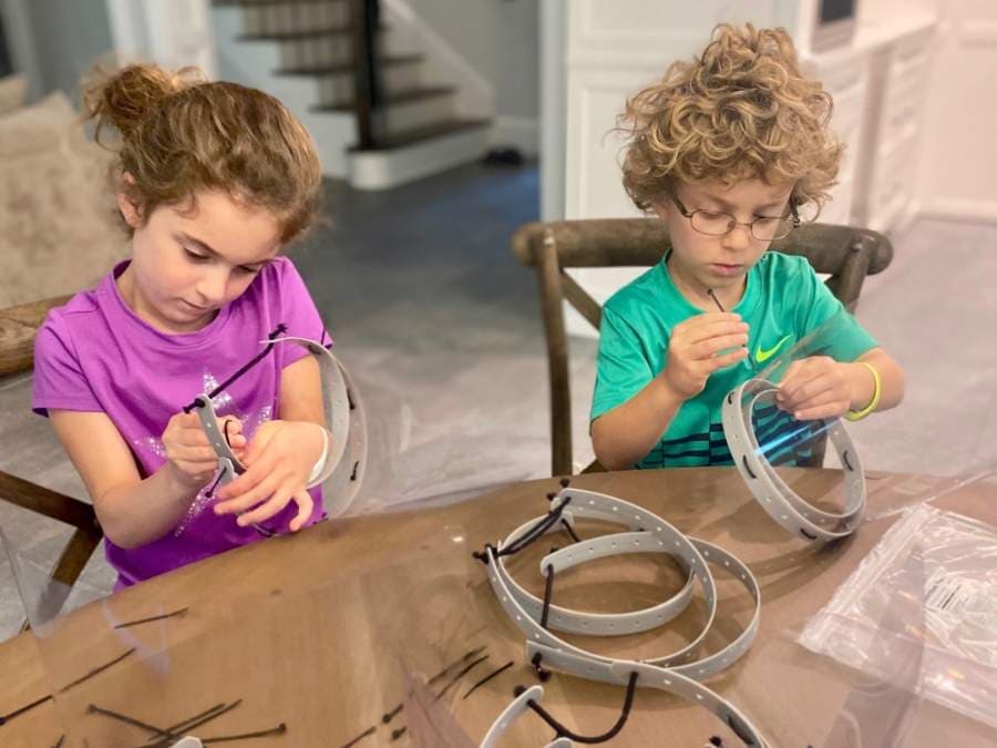 Bellaire families pitched in to create 500 face shields that have gone to local healthcare workers. Courtesy Hannah Nates