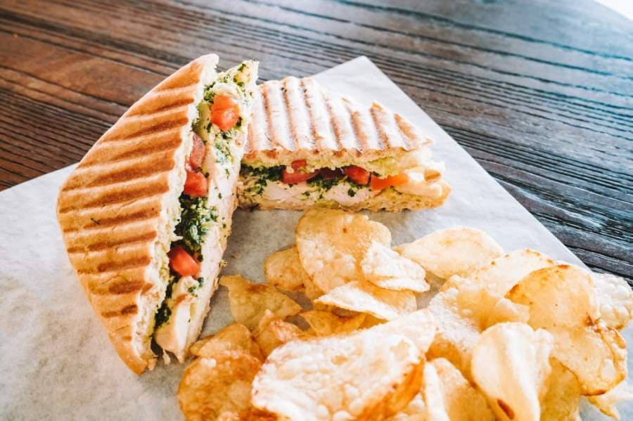 The chicken pesto panini ($8.50) is made with grilled chicken and house-made pesto and is served with chips. (Courtesy Duino Coffee)