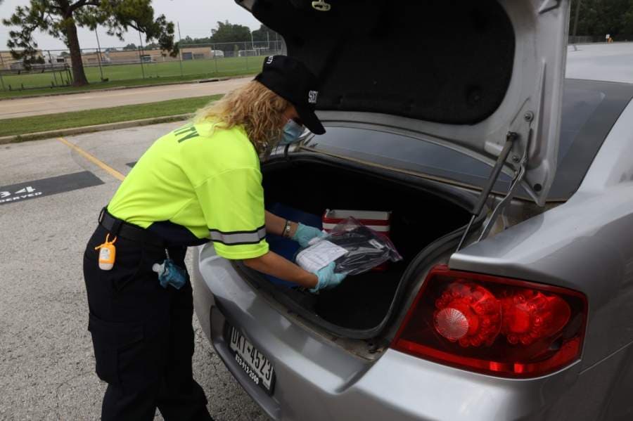 Katy ISD staff members distribute technology devices for students on April 22. (Courtesy Katy ISD)