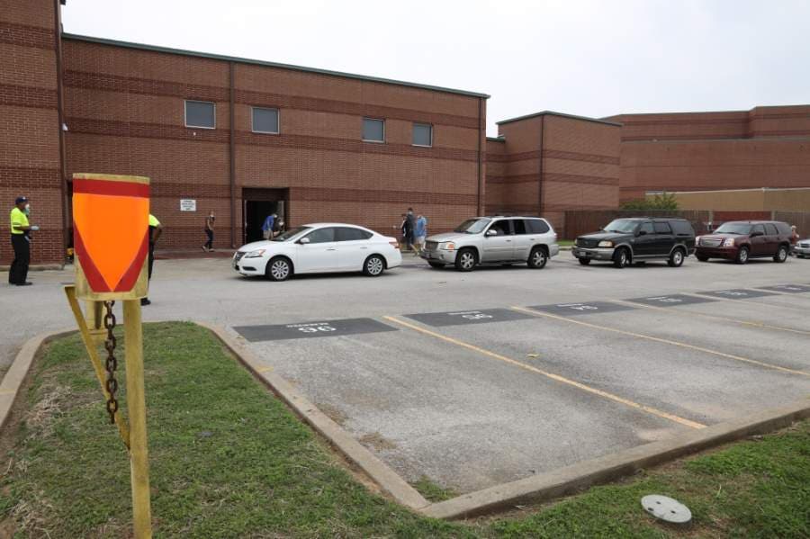 Katy ISD staff members distribute technology devices for students on April 22. (Courtesy Katy ISD)