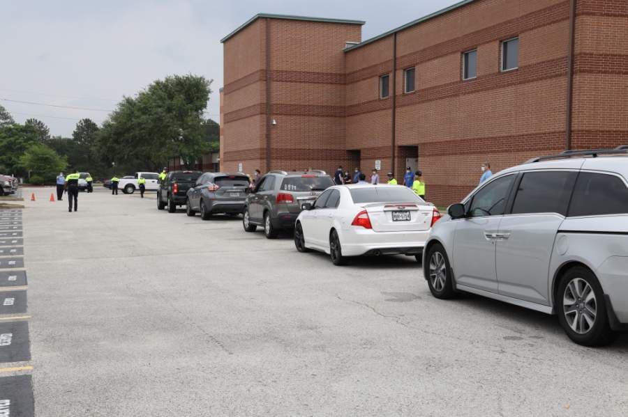 Katy ISD staff members distribute technology devices for students on April 22. (Courtesy Katy ISD)