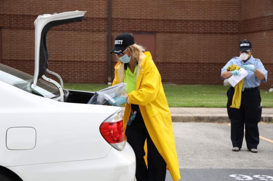 Katy ISD staff members distribute technology devices for students on April 22. (Courtesy Katy ISD)