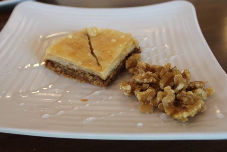 Middle Eastern baklava, with walnut and drizzled with house syrup, is a popular dessert. (Brian Perdue/Community Impact Newspaper)